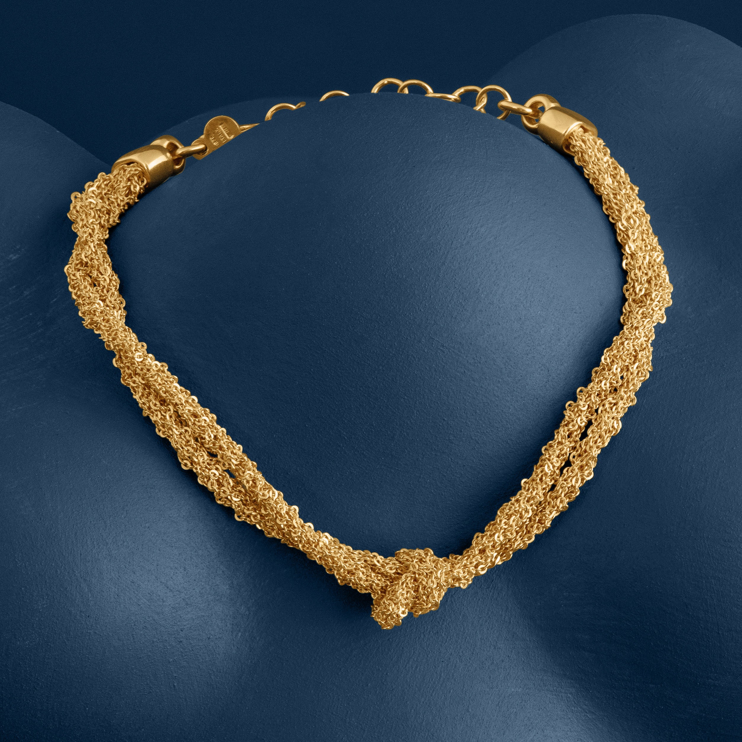 Loel Gold Thread Double Knot Bracelet Alternative on Blue Background