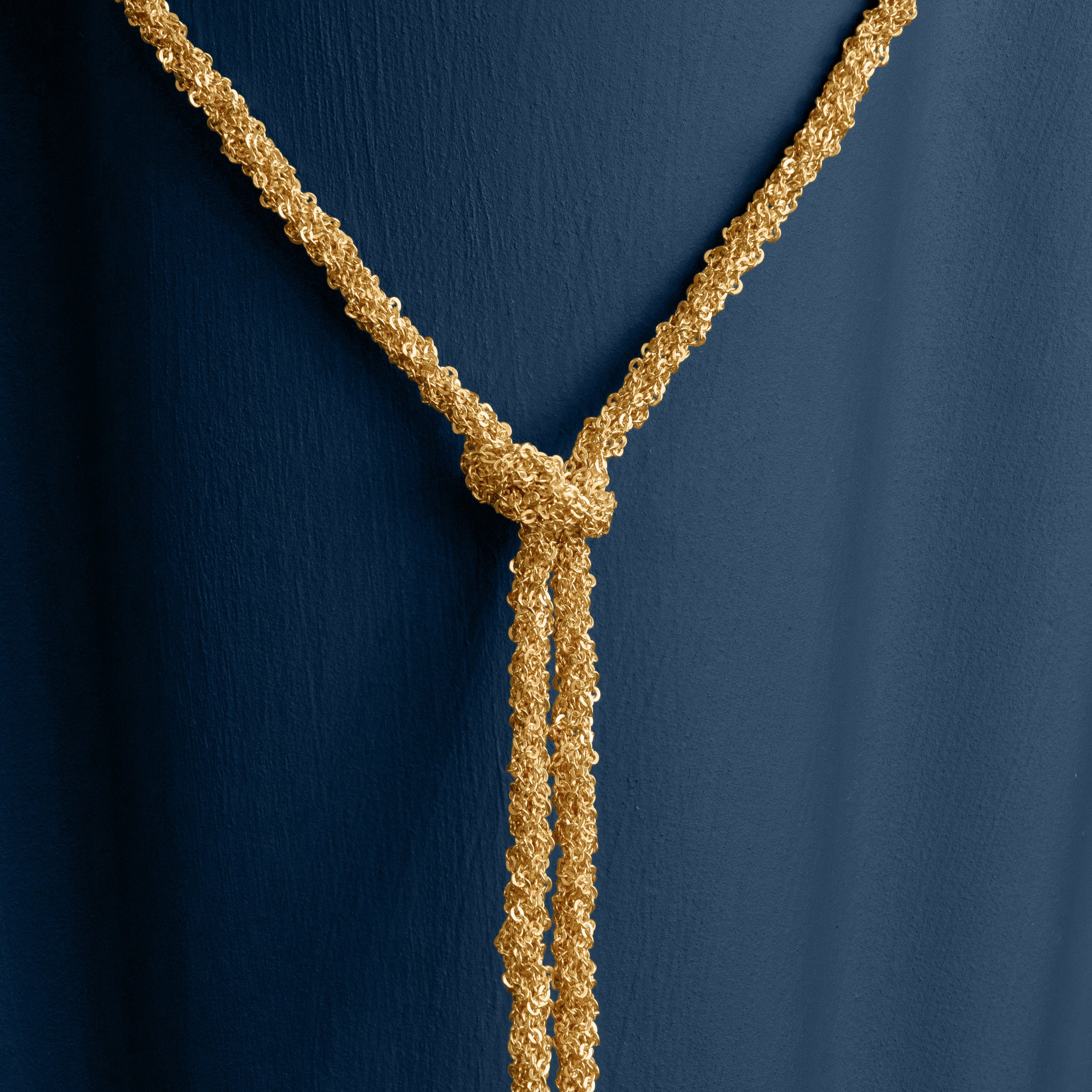 Loel Gold Thread Lariat Necklace close up on knot