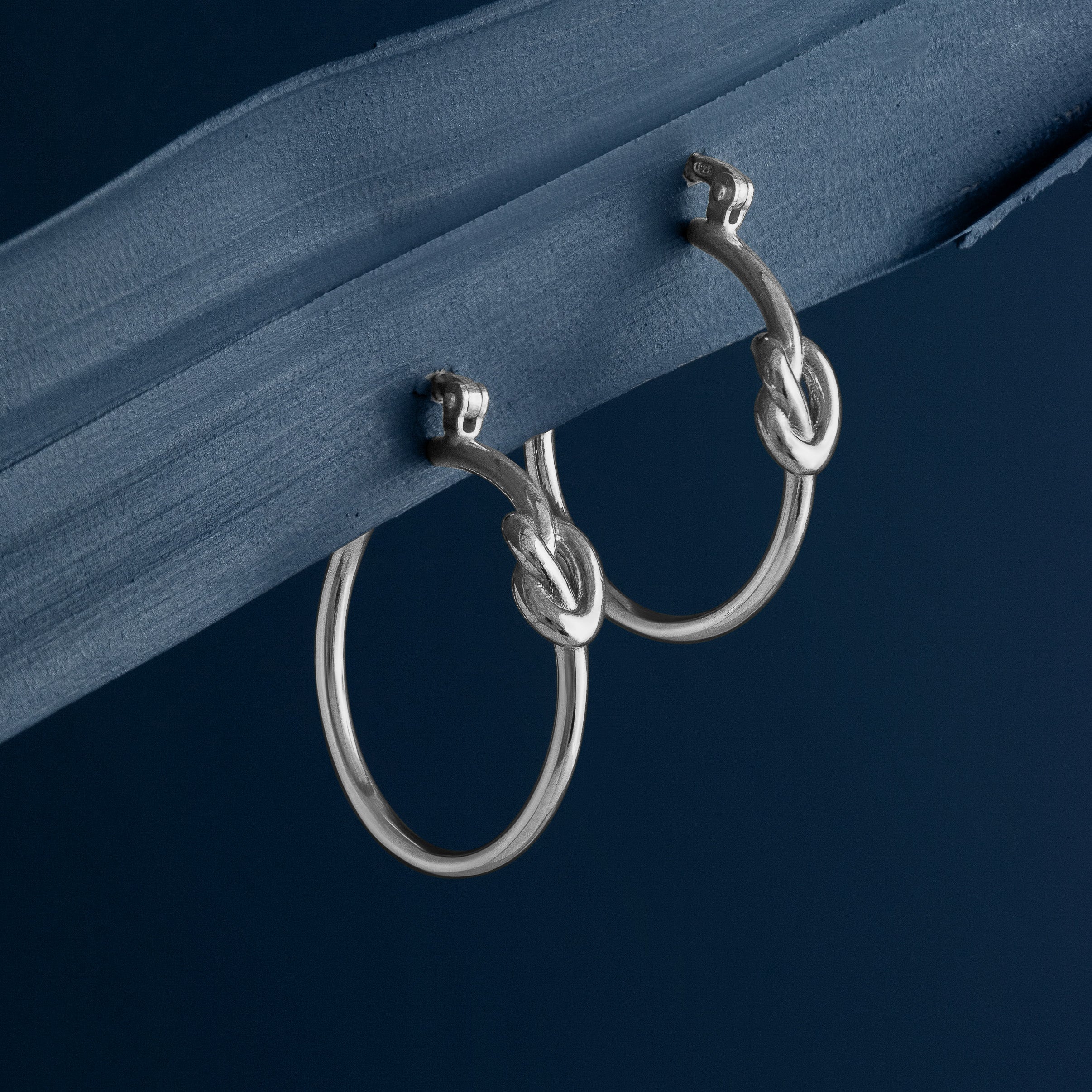 SILVER LOVE KNOT HOOP EARRINGS