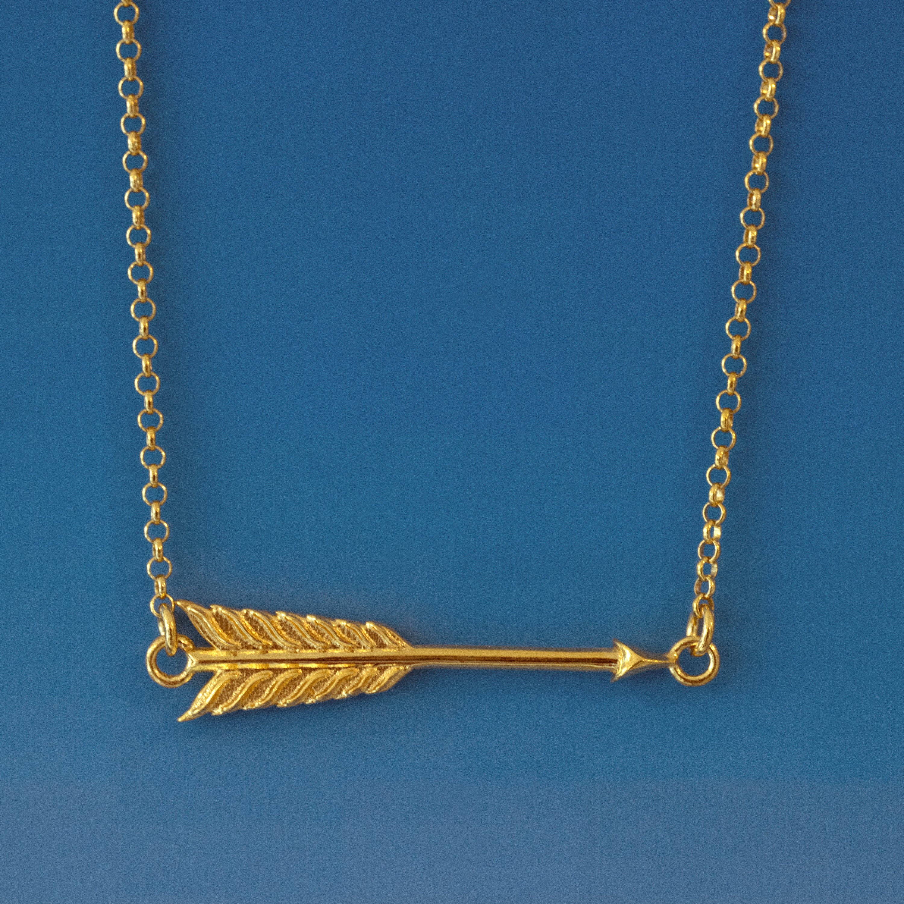 Gold Arrow Pendant.