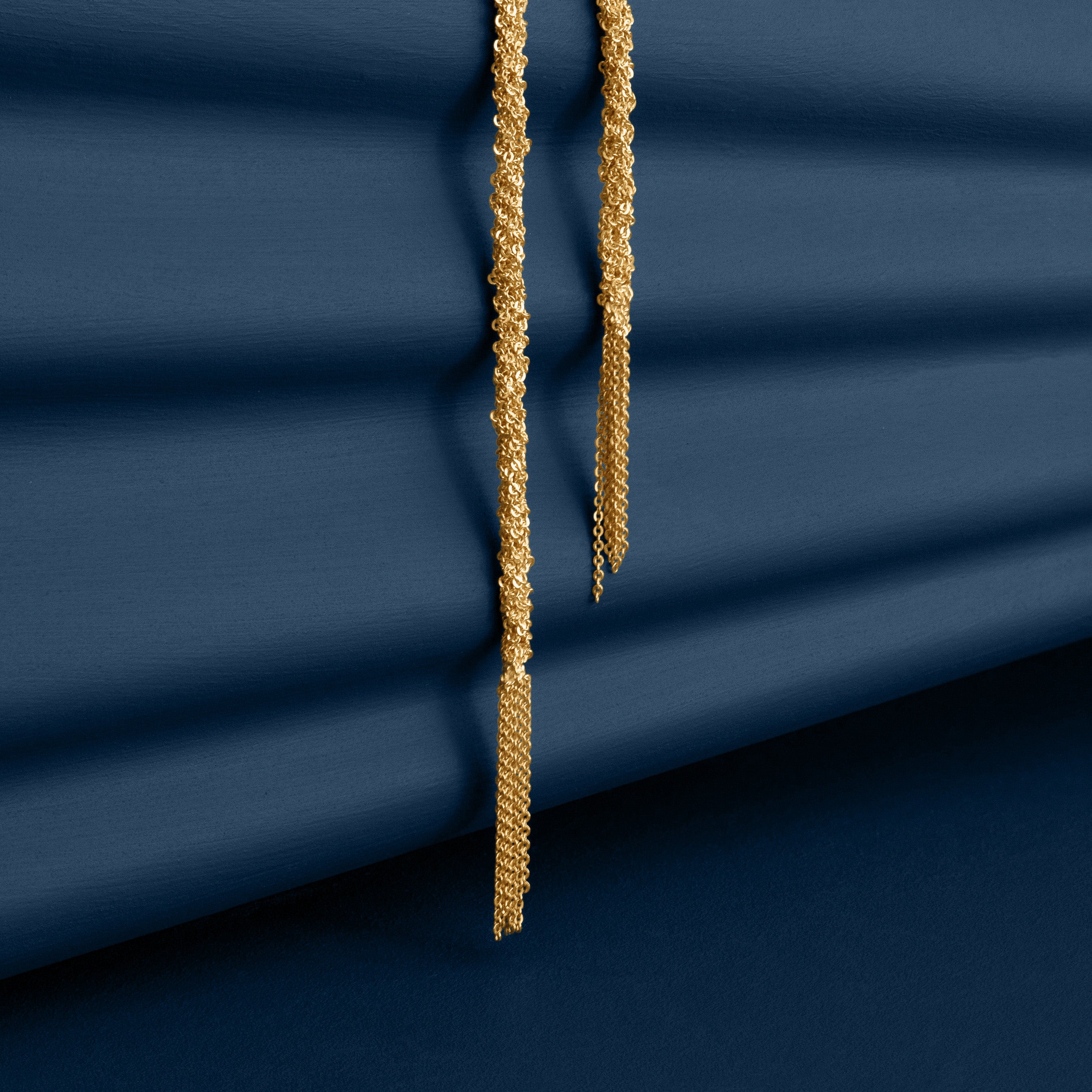 Loel Gold Thread Lariat Necklace close up of Tassels