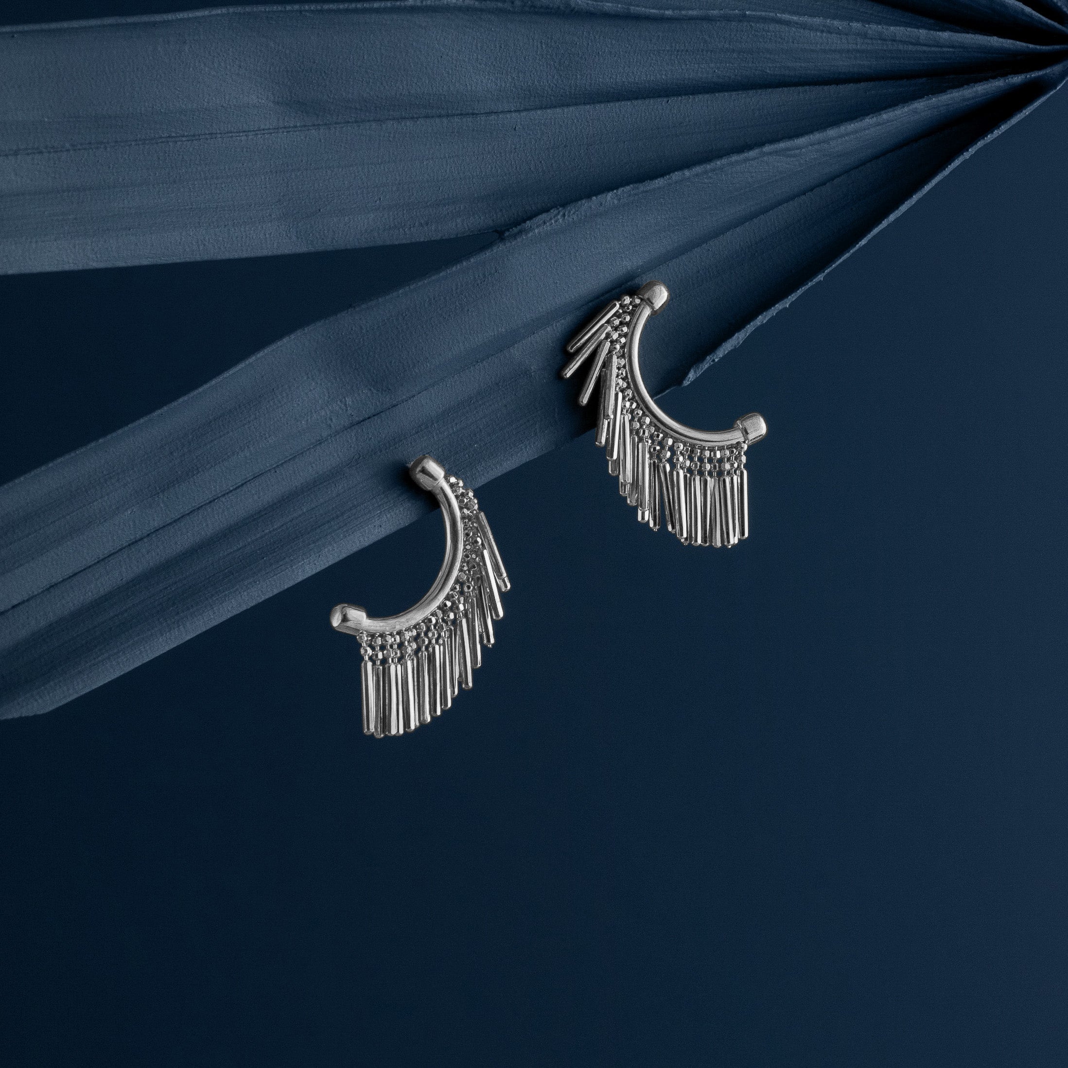 LOEL - Silver Mini Tassel Earrings on Blue