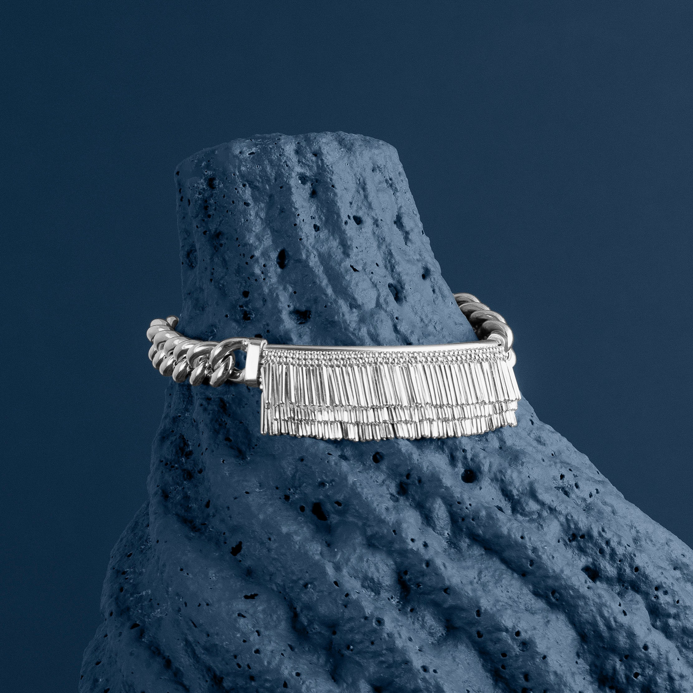 Loel - Silver and Tassel and Chain bracelet on textured blue stone