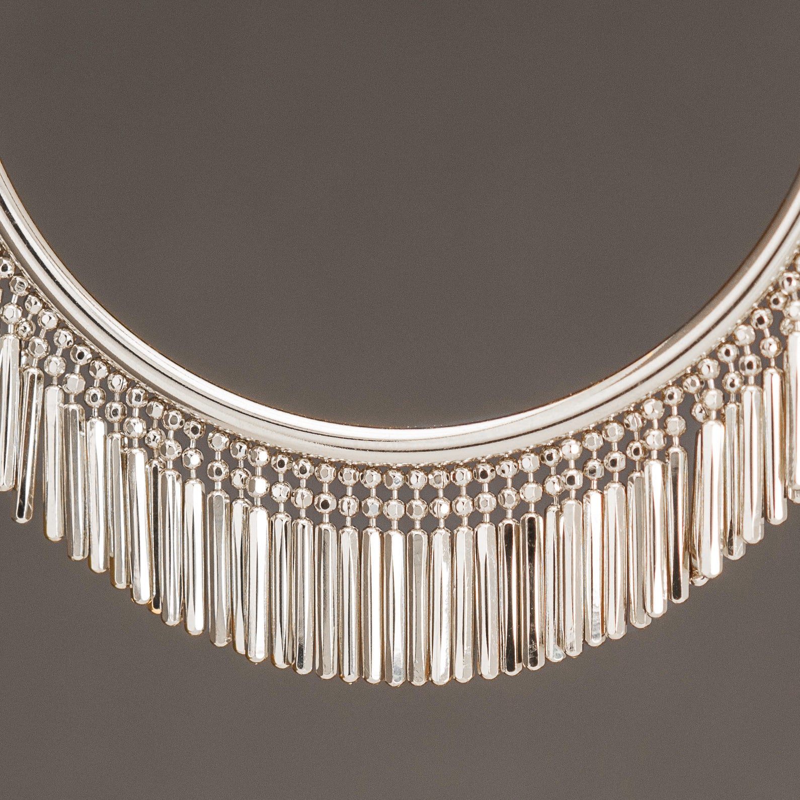 Close-up of Silver Tassel Bangle - Hand made in Italy using recycled sterling silver